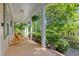 Charming front porch with rocking chairs, offering a serene view of the surrounding greenery at 102 Treadwell Ct, Cary, NC 27513