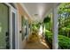Relaxing front porch featuring rocking chairs and a verdant view at 102 Treadwell Ct, Cary, NC 27513