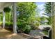 Inviting front porch with brick flooring and lush greenery, perfect for relaxing at 102 Treadwell Ct, Cary, NC 27513