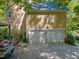A two-car garage exterior showing ample parking and storage space, with driveway and partial view of vehicle at 102 Treadwell Ct, Cary, NC 27513
