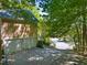 Attached two-car garage featuring white doors and a paved driveway leading to a neighborhood street at 102 Treadwell Ct, Cary, NC 27513