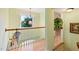 Upstairs hallway featuring a window and a view to the outside at 102 Treadwell Ct, Cary, NC 27513
