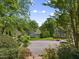 A lush residential neighborhood with sidewalks, mature trees, and well-maintained homes creating a peaceful atmosphere at 102 Treadwell Ct, Cary, NC 27513