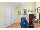 Office space showcasing a comfortable chair, large closet, and ample storage with natural lighting at 102 Treadwell Ct, Cary, NC 27513