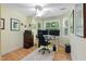 Bright office space with a large desk, two computer monitors, and natural light from multiple windows at 102 Treadwell Ct, Cary, NC 27513