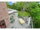 Large backyard deck overlooking a lush garden, ideal for outdoor dining and gatherings at 1024 W Markham Ave, Durham, NC 27701