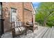 Private balcony with outdoor furniture and a view of the surrounding landscape at 1024 W Markham Ave, Durham, NC 27701