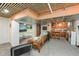 Finished basement area with a lounge area, kitchenette, and unique ceiling at 1024 W Markham Ave, Durham, NC 27701