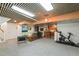 Spacious basement area with kitchenette, entertainment zone, and exercise space at 1024 W Markham Ave, Durham, NC 27701