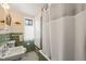 Classic bathroom featuring vintage tile, fixtures, and natural light at 1024 W Markham Ave, Durham, NC 27701