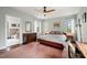 Bedroom with bathroom access, complemented by neutral tones and natural light at 1024 W Markham Ave, Durham, NC 27701