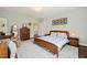Inviting bedroom with hardwood floors, vintage furniture, and ample closet space at 1024 W Markham Ave, Durham, NC 27701