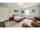 Comfortable bedroom with hardwood floors and a calming color palette at 1024 W Markham Ave, Durham, NC 27701
