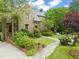 Beautiful brick home with landscaped front yard and stone walkway at 1024 W Markham Ave, Durham, NC 27701