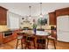 Gourmet kitchen featuring a large island, stainless steel appliances, and custom cabinetry at 1024 W Markham Ave, Durham, NC 27701