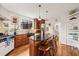 Spacious kitchen with a large island, stainless steel appliances, and hardwood floors at 1024 W Markham Ave, Durham, NC 27701