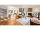 Spacious living room featuring hardwood floors, fireplace, staircase, neutral color scheme, and seamless flow into other spaces at 1024 W Markham Ave, Durham, NC 27701