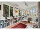 Inviting office with natural light, a cozy reading nook, and a floor-to-ceiling bookshelf at 1024 W Markham Ave, Durham, NC 27701