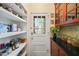 Well-organized pantry with ample storage shelves, convenient for storing groceries and supplies at 1024 W Markham Ave, Durham, NC 27701