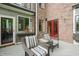 Charming outdoor patio with comfortable seating, perfect for relaxing and entertaining at 1024 W Markham Ave, Durham, NC 27701