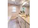 Clean bathroom with white vanity, marble counters, and tiled floor at 104 Silver Fox Ct, Cary, NC 27511