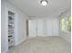 Neutral bedroom featuring carpet, double closets, and a window at 104 Silver Fox Ct, Cary, NC 27511