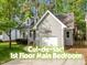 Charming gray home with a manicured lawn and attached one car garage in a cul-de-sac at 104 Silver Fox Ct, Cary, NC 27511
