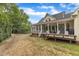 Private backyard with a large deck, screened porch, and well-maintained lawn at 106 Kenneil Ct, Apex, NC 27502