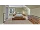 Attic bedroom showcases a window, neutral walls, wall-to-wall carpet, and unique furniture at 106 Kenneil Ct, Apex, NC 27502