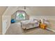 Attic bedroom with neutral walls, window with curtains, ceiling fan, and carpeted floors at 106 Kenneil Ct, Apex, NC 27502