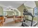 Large carpeted bedroom with ceiling fan, recessed lighting, a sofa, and a treadmill at 106 Kenneil Ct, Apex, NC 27502