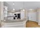 Eat-in kitchen featuring updated appliances, ample cabinetry, and a breakfast bar area at 106 Kenneil Ct, Apex, NC 27502