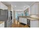 Bright kitchen features stainless steel appliances, granite countertops, and a breakfast nook with backyard views at 106 Kenneil Ct, Apex, NC 27502