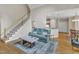 Open living space with stairs to the second floor, seamlessly connected to the kitchen at 106 Kenneil Ct, Apex, NC 27502