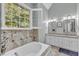 This is a beautiful main bathroom, with a double vanity and plenty of natural light at 106 Kenneil Ct, Apex, NC 27502