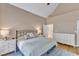 Spacious main bedroom features soft decor, a vaulted ceiling and an ensuite bathroom at 106 Kenneil Ct, Apex, NC 27502