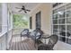 Inviting screened porch with a ceiling fan and comfortable wicker seating for enjoying outdoor relaxation at 106 Kenneil Ct, Apex, NC 27502