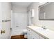 Bathroom featuring a shower and tub, white vanity, and neutral paint at 1100 Brandywine Ln, Rocky Mount, NC 27804