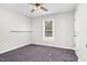 Carpeted bedroom with a ceiling fan, natural light, and neutral paint at 1100 Brandywine Ln, Rocky Mount, NC 27804