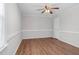 Spacious bedroom featuring wood floors, neutral paint, and ceiling fan at 1100 Brandywine Ln, Rocky Mount, NC 27804