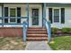 Inviting brick steps leading to a bright and cheerful entrance, framed by neatly trimmed shrubs at 1100 Brandywine Ln, Rocky Mount, NC 27804