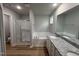 Modern bathroom featuring a shower, tub, and double vanity with granite countertops at 115 Oakfield Trace Dr, Four Oaks, NC 27524