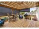 Back porch with view of yard, equipped with outdoor grill and table set at 1202 Lexington Ridge Ln, Apex, NC 27502