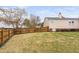 Spacious backyard features a wooden fence for privacy, perfect for outdoor activities and relaxation at 1202 Lexington Ridge Ln, Apex, NC 27502