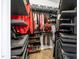 Organized walk-in closet with custom shelving and ample storage space at 1202 Lexington Ridge Ln, Apex, NC 27502