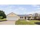 Charming one-story home with a two-car garage and a well-manicured front lawn and flowerbeds at 1202 Lexington Ridge Ln, Apex, NC 27502