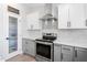 Kitchen featuring stainless appliances, granite countertops, and stylish tile backsplash at 1202 Lexington Ridge Ln, Apex, NC 27502