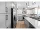 Kitchen featuring stainless steel appliances, granite countertops, and light-colored cabinets at 1202 Lexington Ridge Ln, Apex, NC 27502