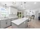 Bright kitchen seamlessly connects to dining area and living room for open concept living at 1202 Lexington Ridge Ln, Apex, NC 27502