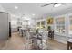Open concept kitchen with a view to the dining area, natural light, and hardwood floors at 1202 Lexington Ridge Ln, Apex, NC 27502
